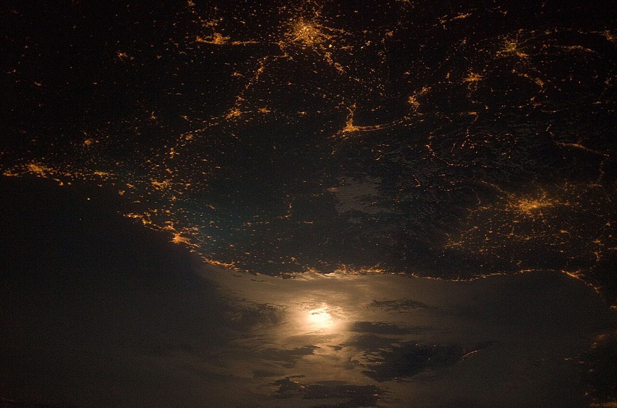 City lights along the France-Italy border photographed from orbit at night