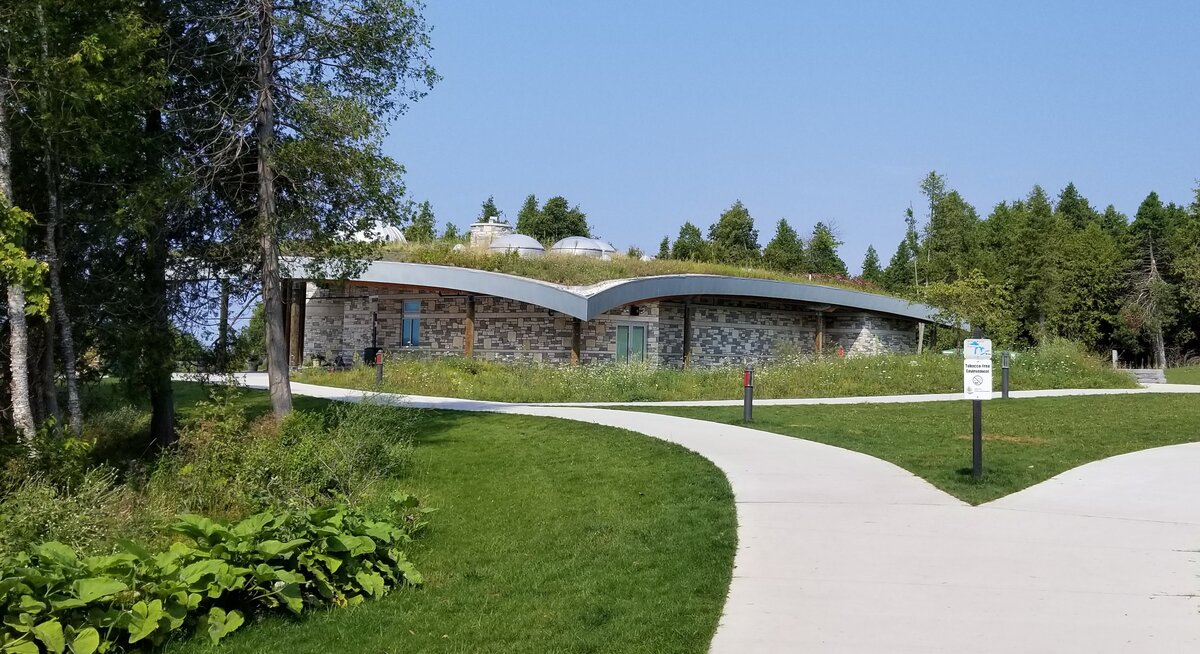 The Headlands International Dark Sky Park visitor center under a starry sky